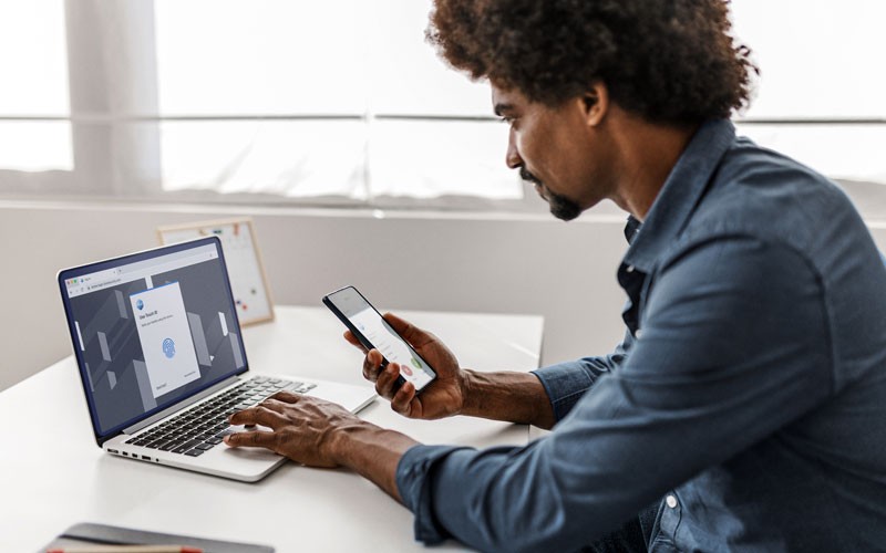 Businessman using Cisco Duo security solutions on his devices