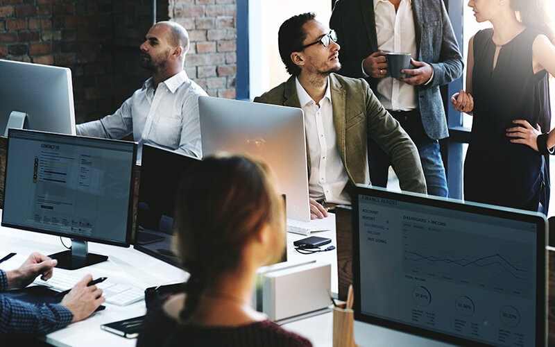 Business team collaborating at someone's desk