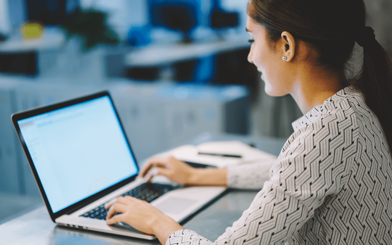 Woman typing on laptop