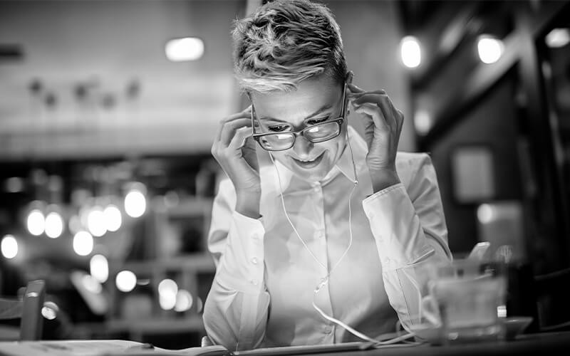 Woman with earphones working