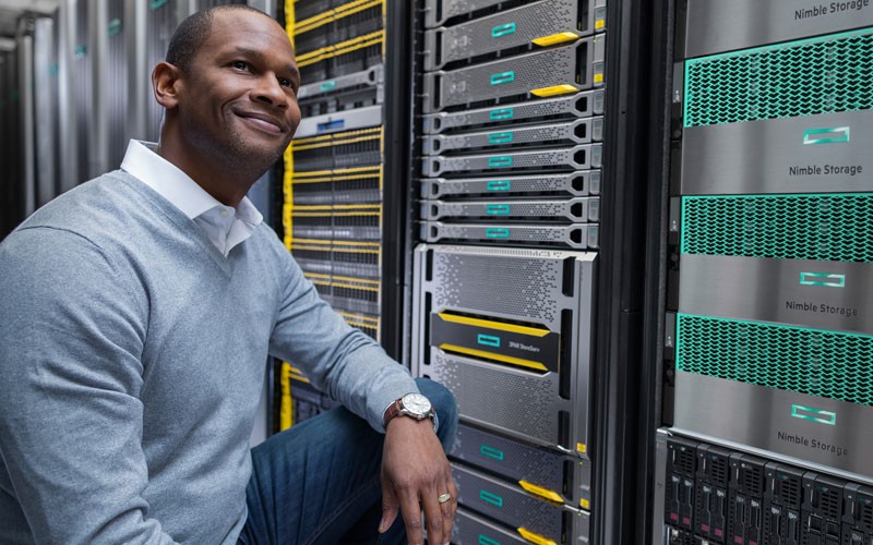 Man smiling in server room