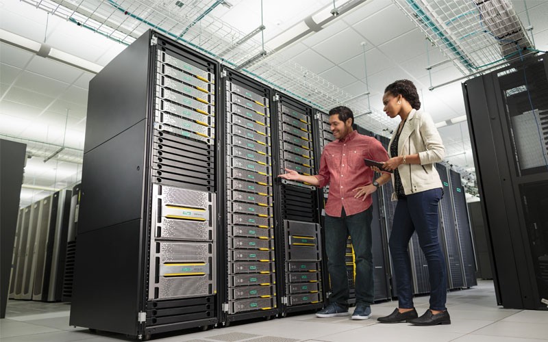 Two professionals in server room