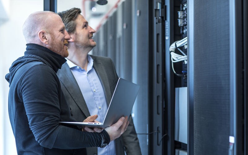 Two men looking at servers