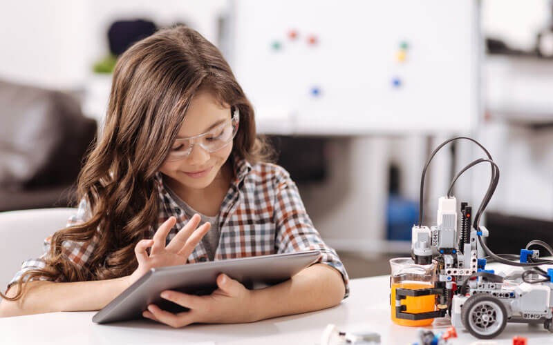 Smiling student on tablet STEM learning