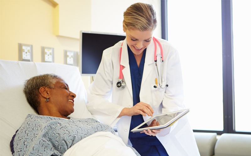 Doctor and patient in hospital room