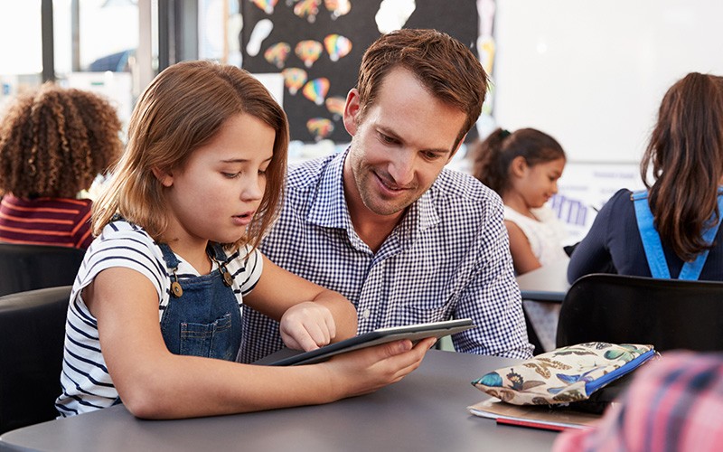 Teacher teaching a student