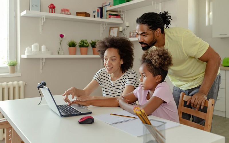 Family using the Chromebook laptop with webcam