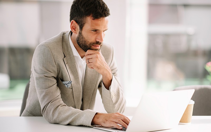 Professional working on his laptop