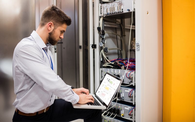 IT technician working in server room