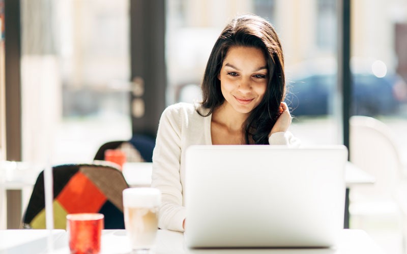 Woman on laptop device remote