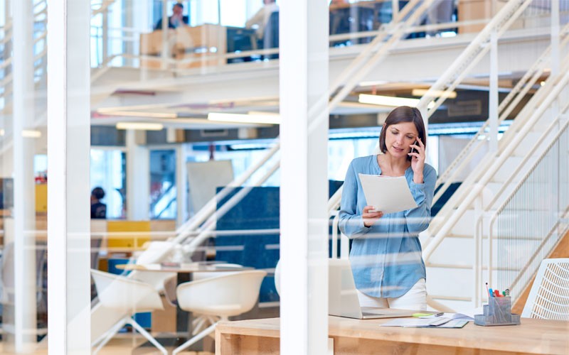 Woman in business office on phone