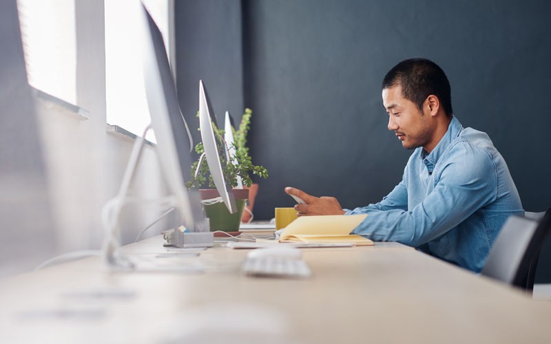 Employee sitting at desktop