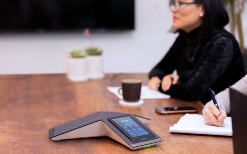 Group of people using Polycom phone