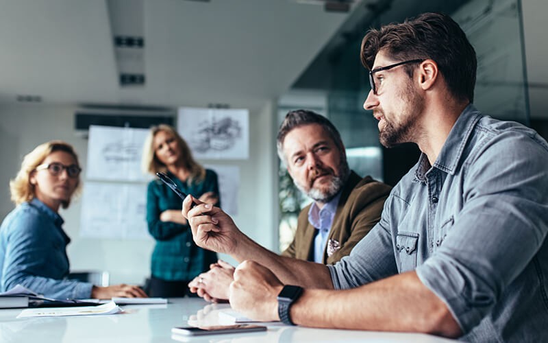 Businessman presenting idea in strategy meeting