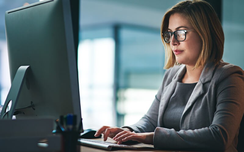 Woman using her devices at work