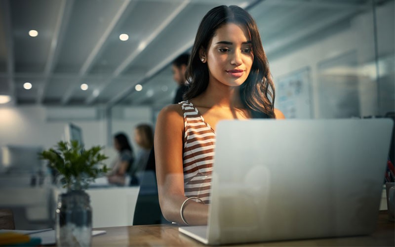 Business woman looking at laptop