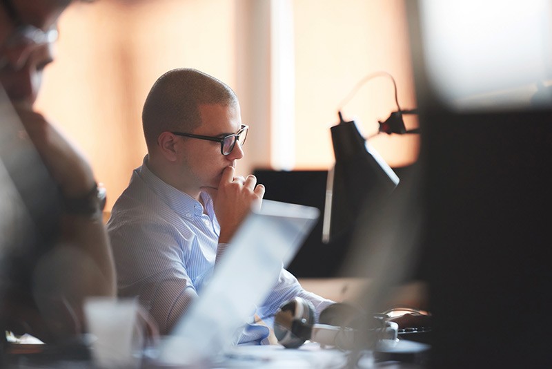 Developer working on computer in office