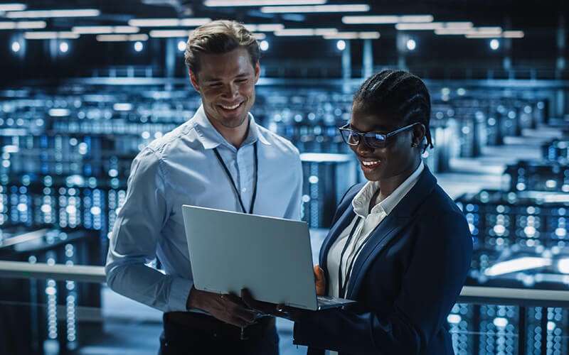 Two person collaborating inside the data center