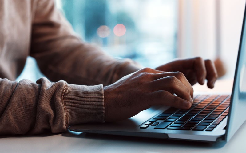 Close up of typing on laptop computer keyboard