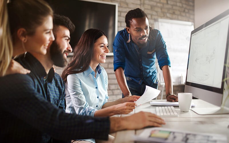 Business professionals brainstorming ideas with various mobile technology in hand